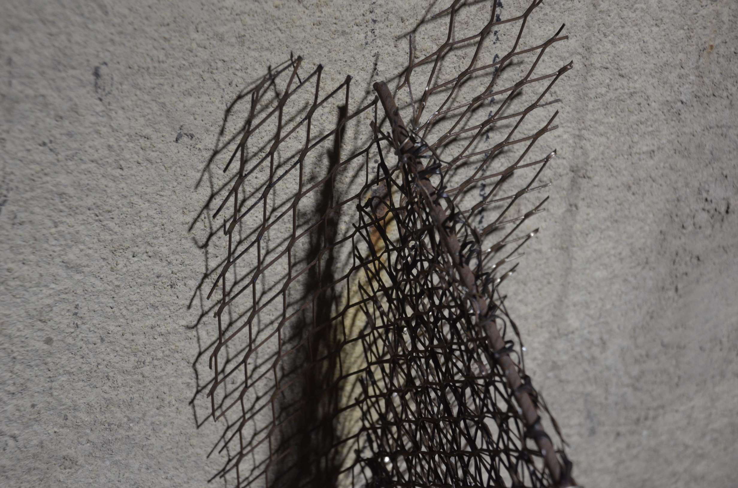 Closeup of mating of armature to existing cement of hull demonstrating lack of attachment before plastering